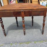 Half moon console opening on a solid walnut round table