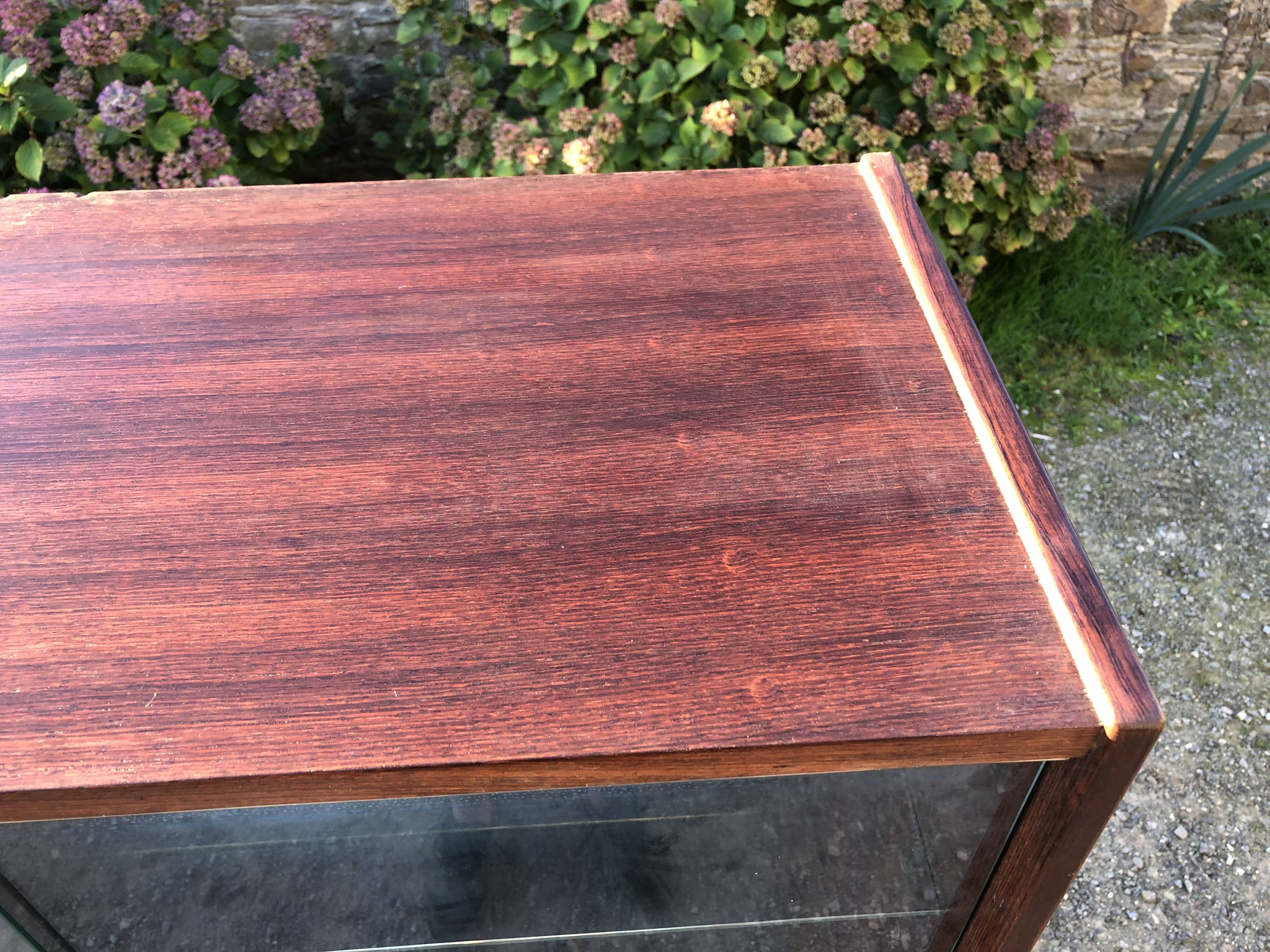 Vintage Scandinavian secretary in rosewood with drawers featuring fin-style handles.