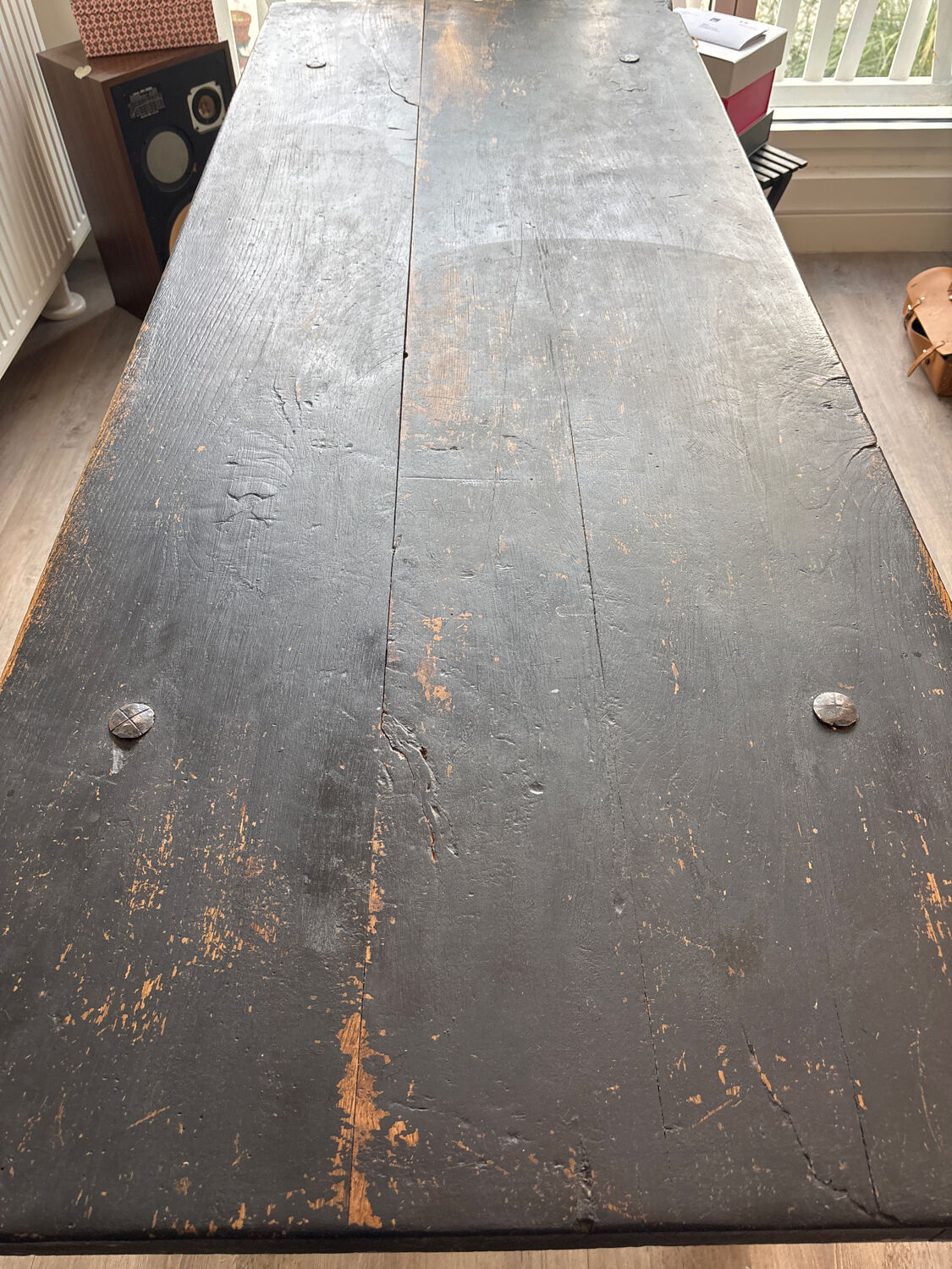 Solid wood farmhouse table with ebony finish.