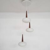 Set of three milk glass and teak pendant lights model NG74 by Louis Kalff for Philips, The Netherlan