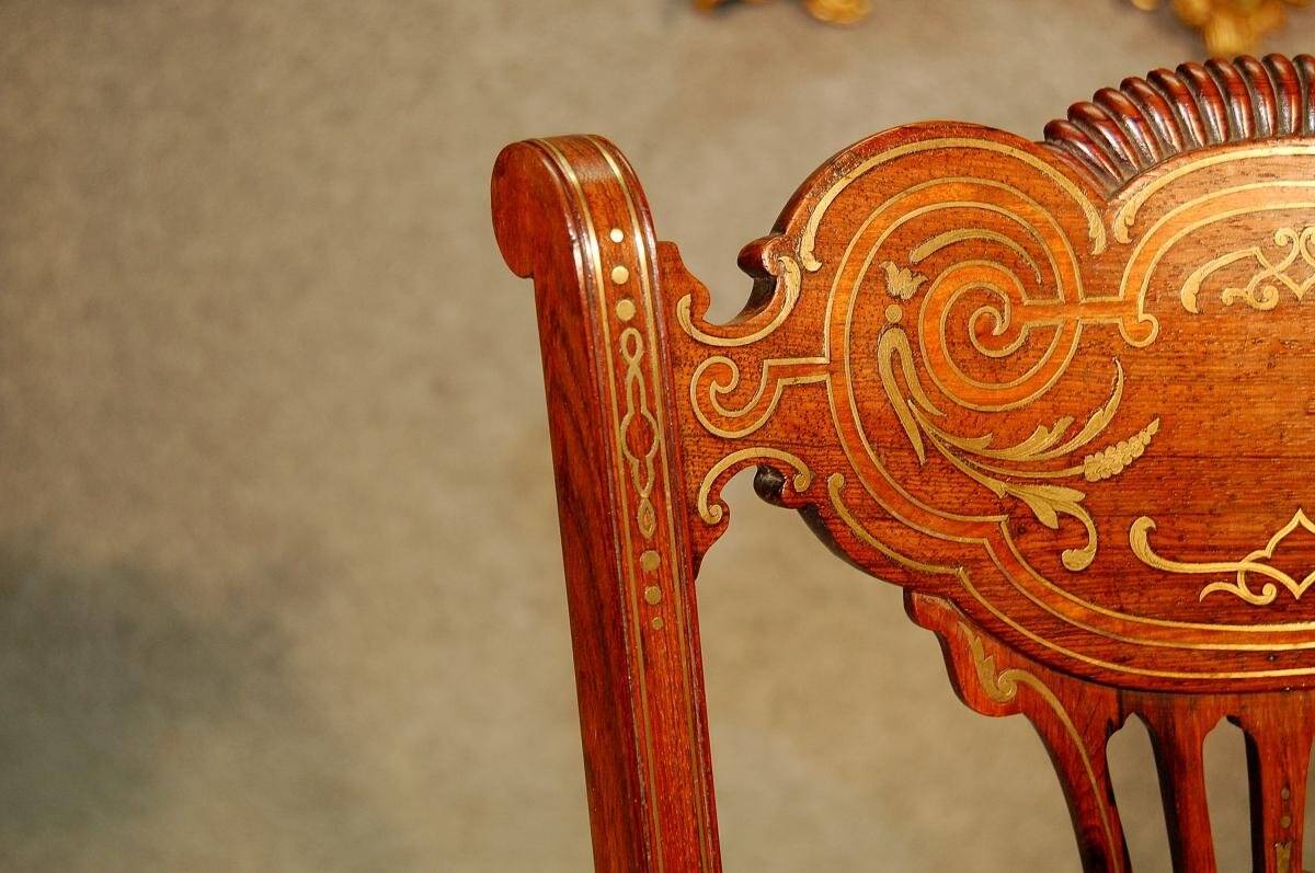 19th century armchair in leather and rosewood inlaid with brass and rosewood