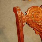 19th century armchair in leather and rosewood inlaid with brass and rosewood