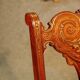 19th century armchair in leather and rosewood inlaid with brass and rosewood