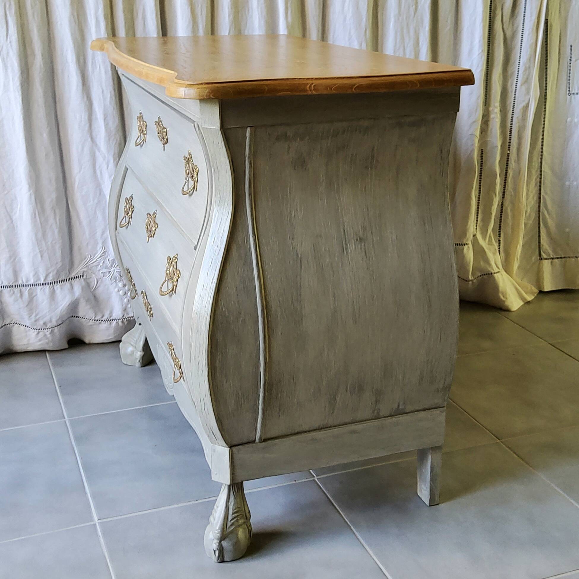 Curved patinated chest of drawers