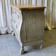 Curved patinated chest of drawers