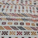 White carpet with multicolored Berber patterns