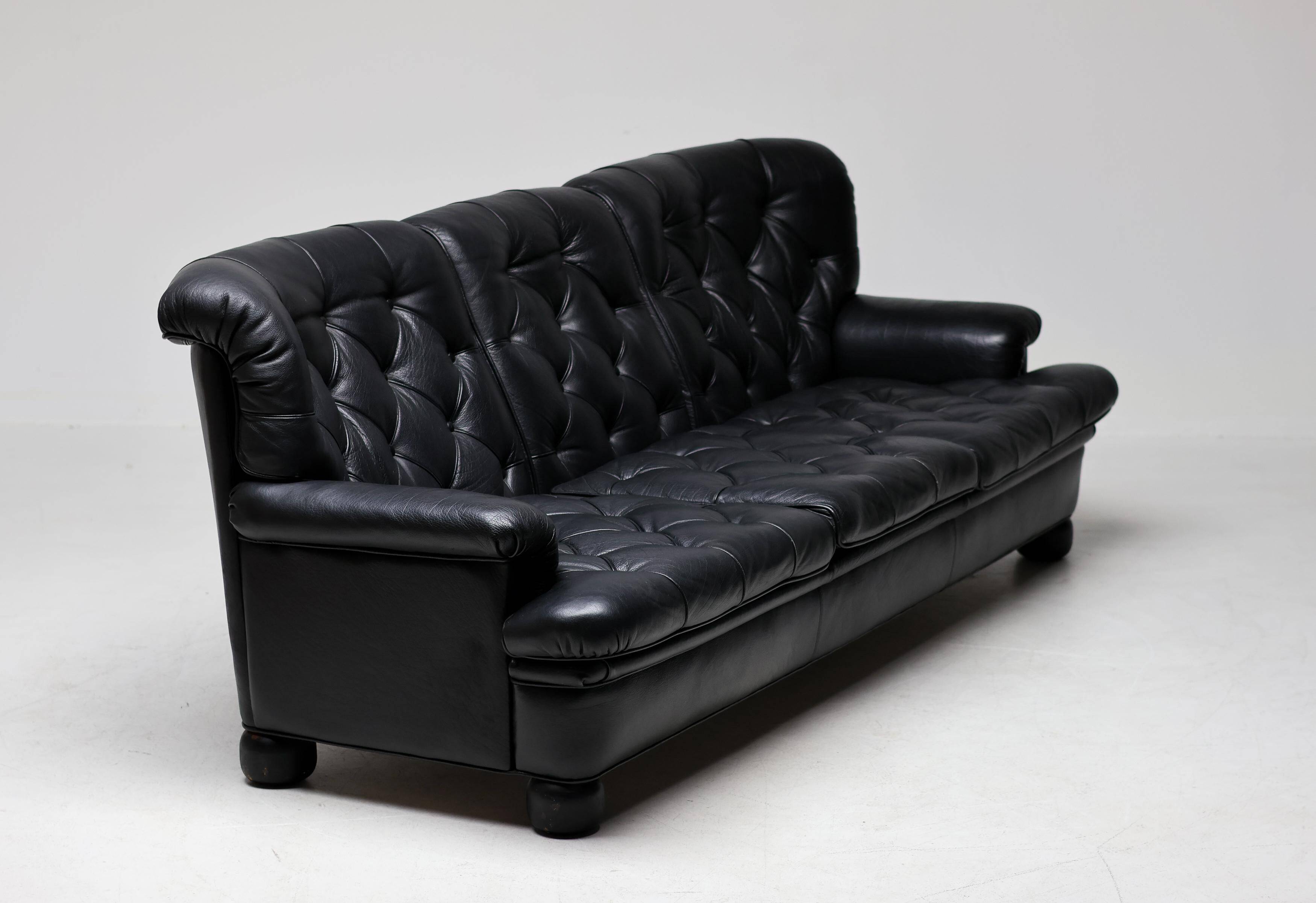 Three-seater sofa "Jupiter" in black leather by Arne Norell, Sweden, 1960.