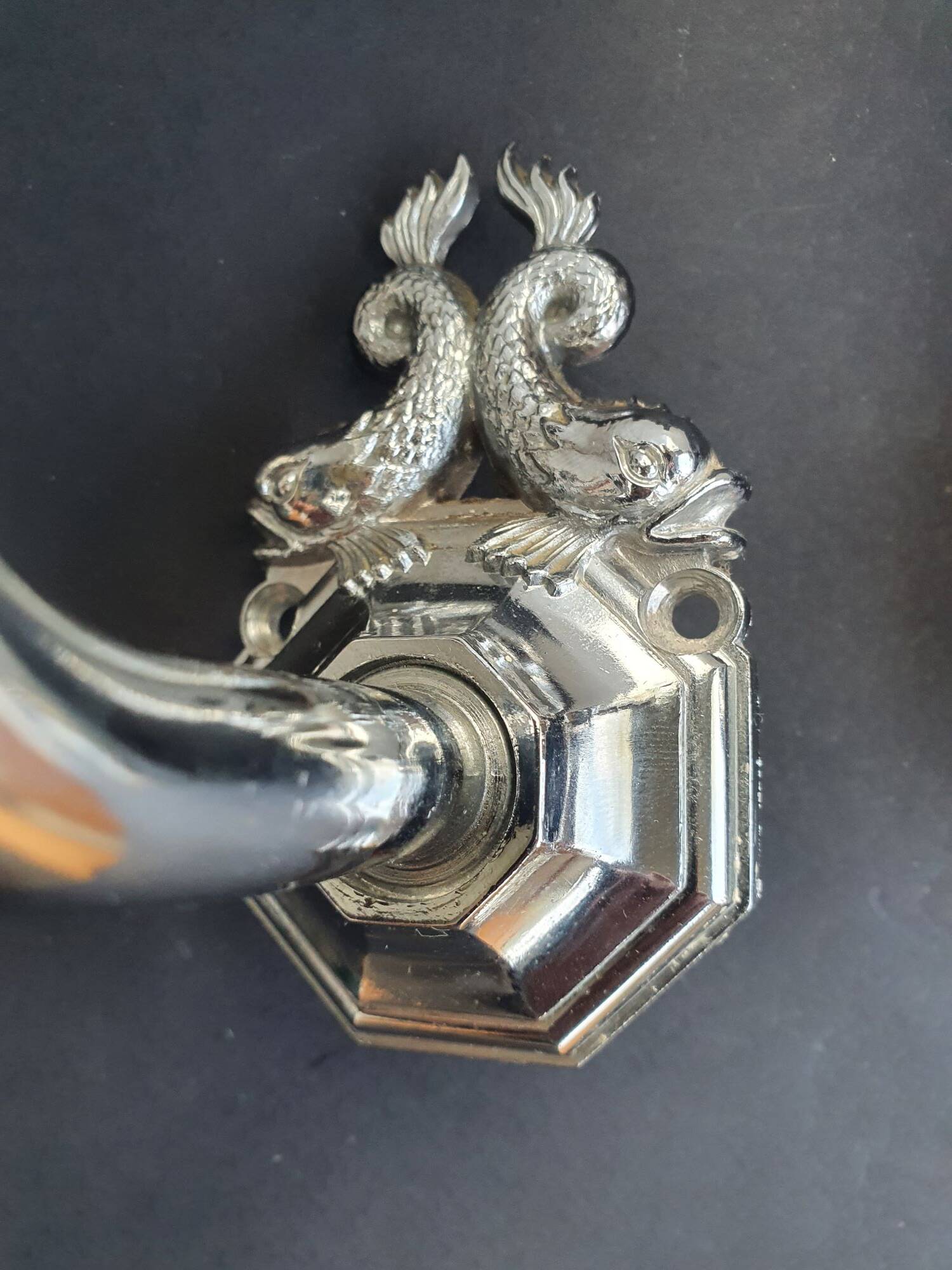 Pair of chrome wall sconces for bathroom with vintage fish pattern.