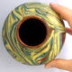 Brown, yellow and green marbled ceramic vase