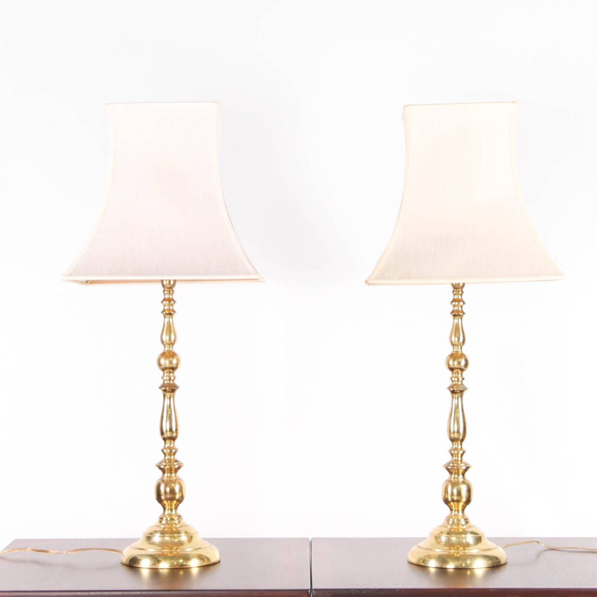 Pair of large brass lamps