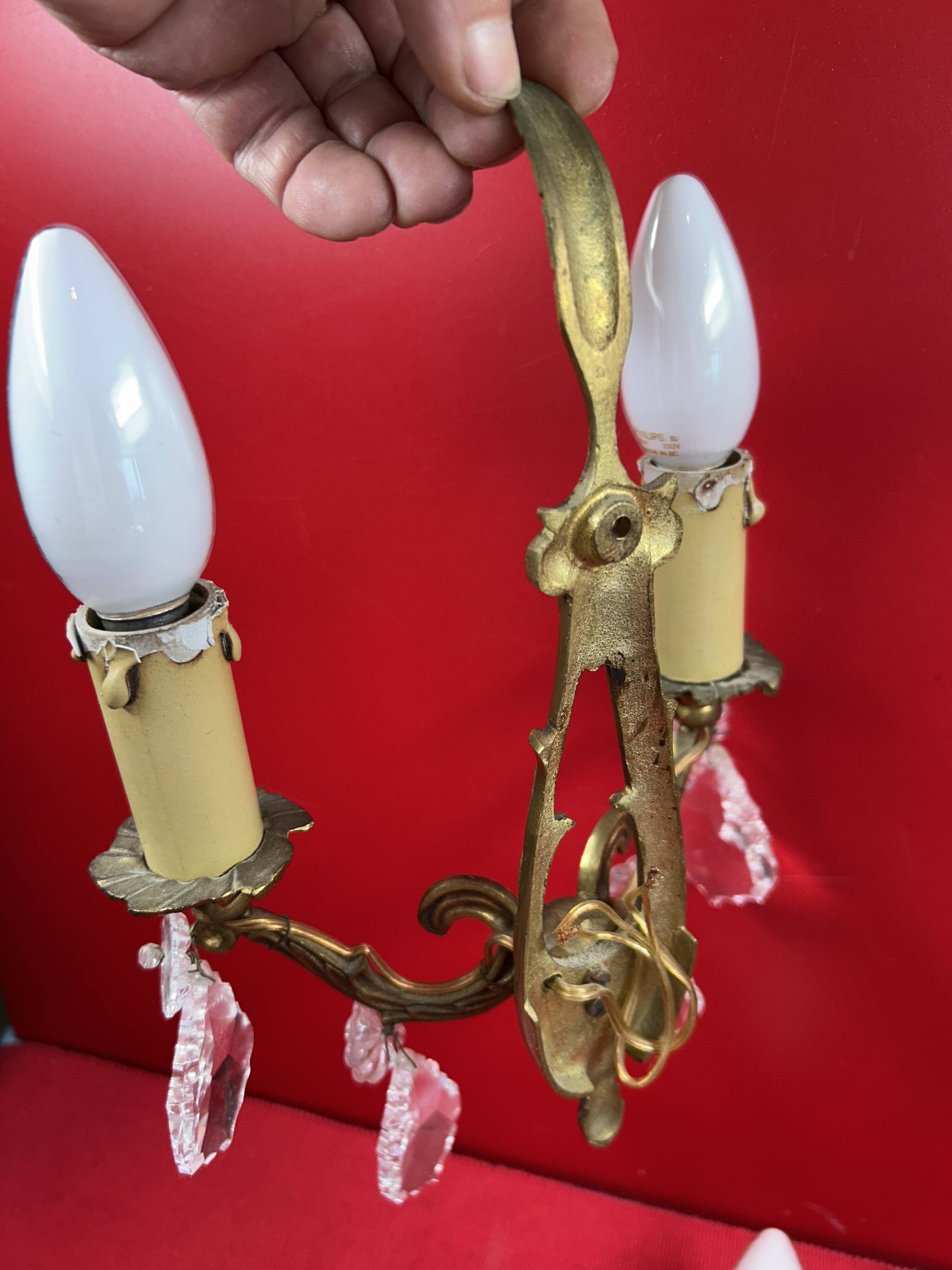 Pair of Louis XVI style wall lights, gilded bronze