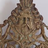 19th century beveled mirror with metal decor