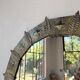 Brutalist round hammered gold metal mirror