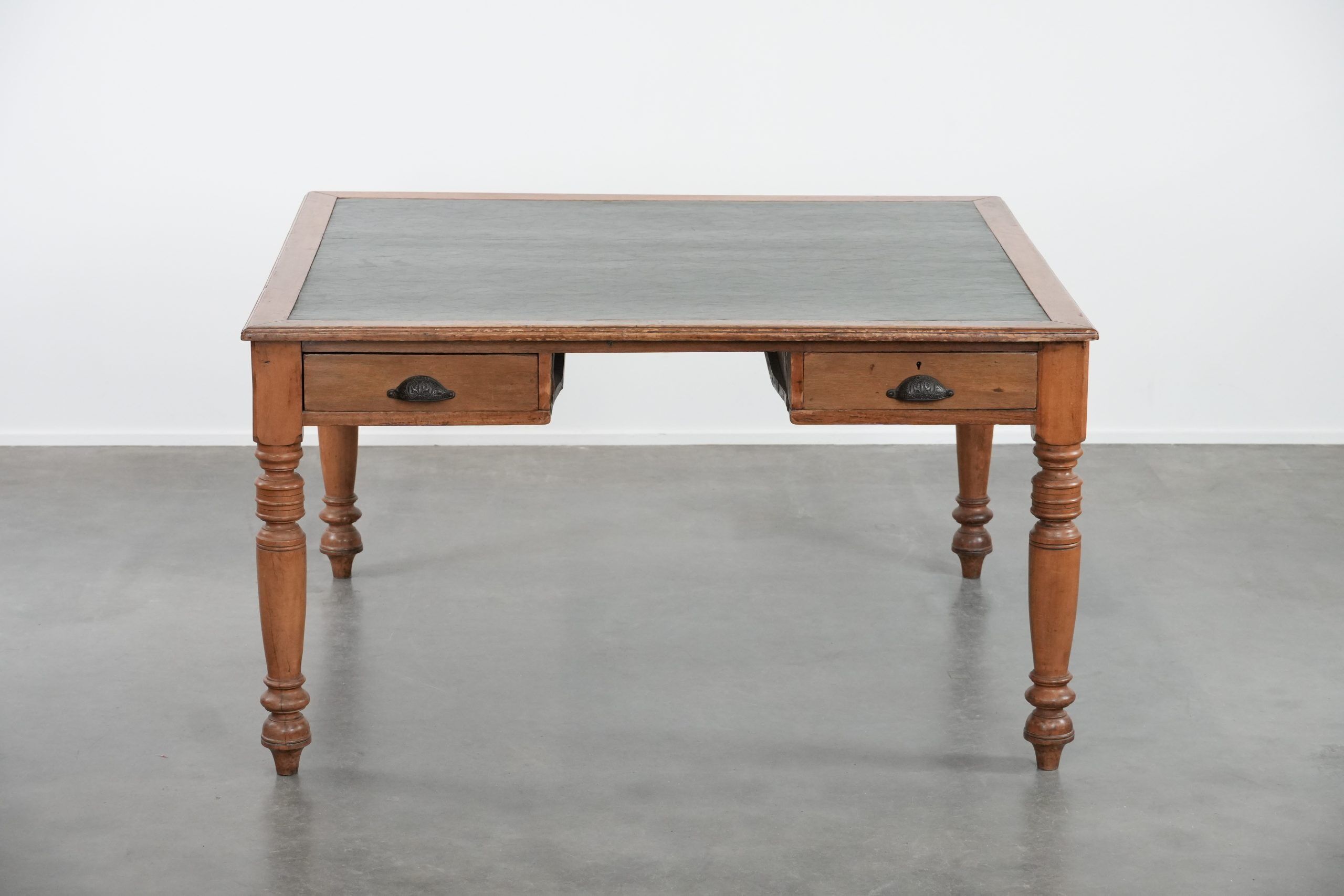Antique writing table / partner desk with 4 drawers and a green leather top