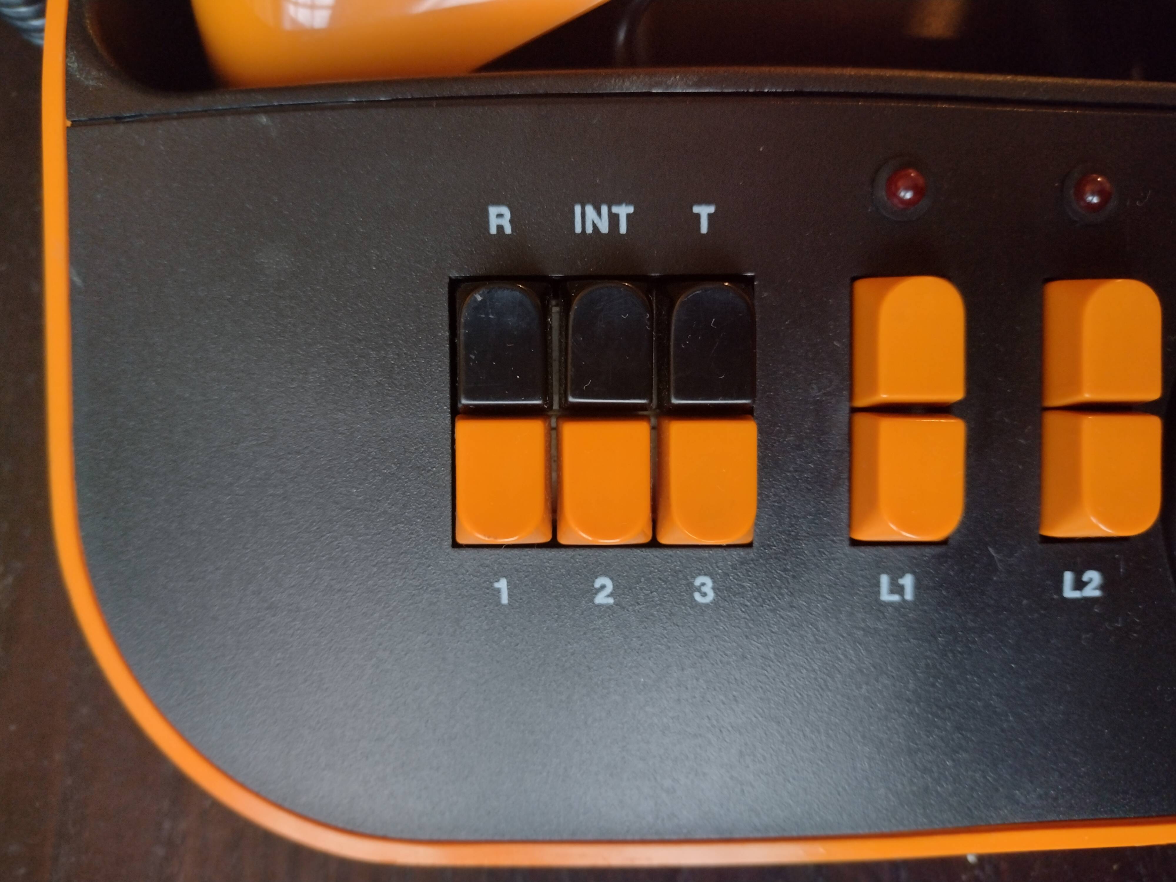 Vintage orange telic phone with ptt dial