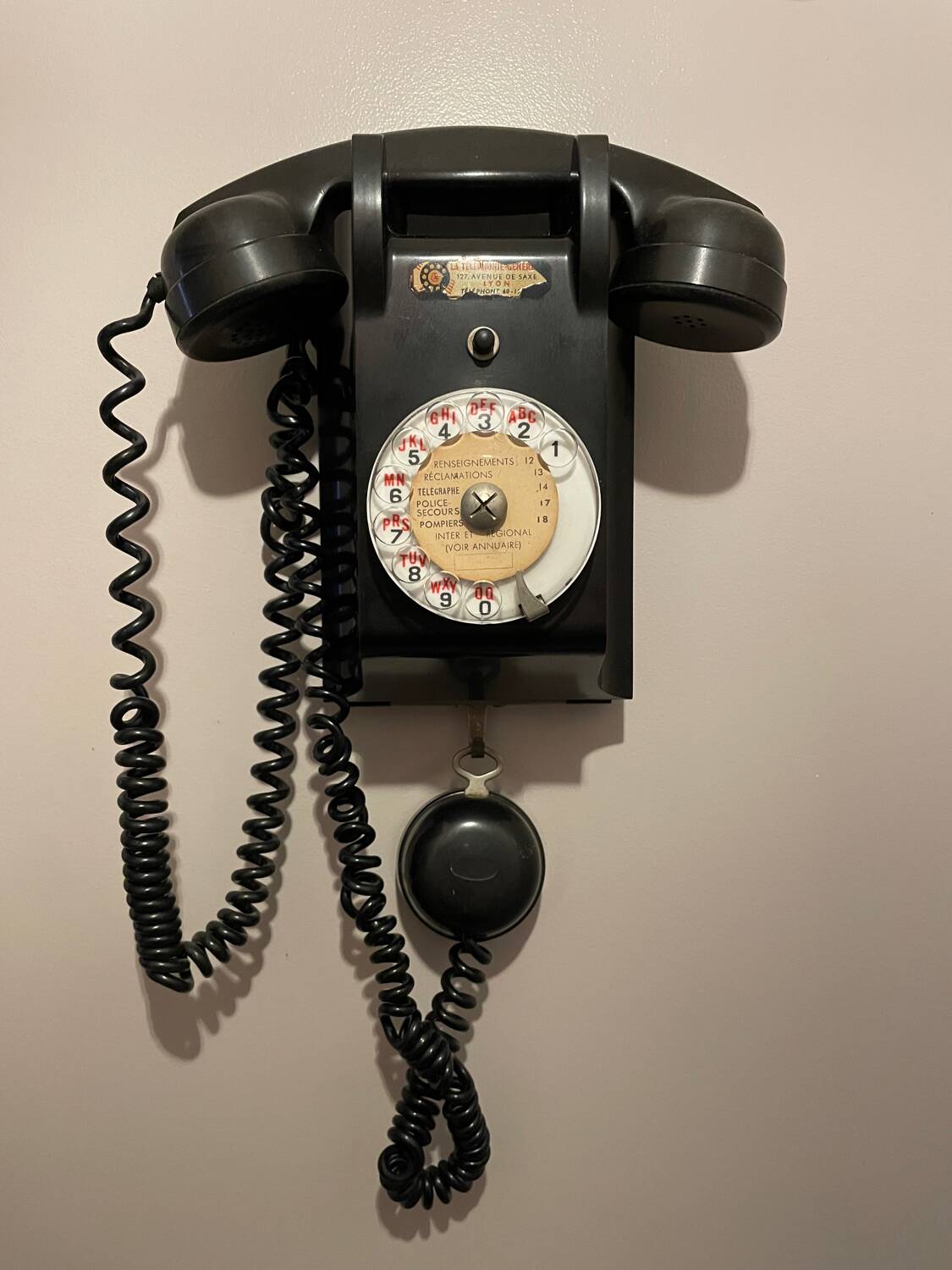 Old Ericsson wall telephone in black bakelite