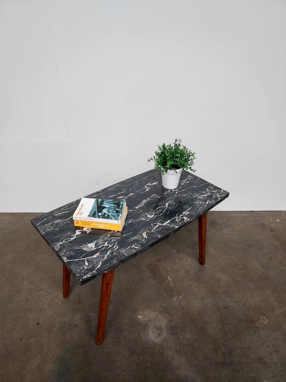 Marble effect Formica coffee table - flared legs