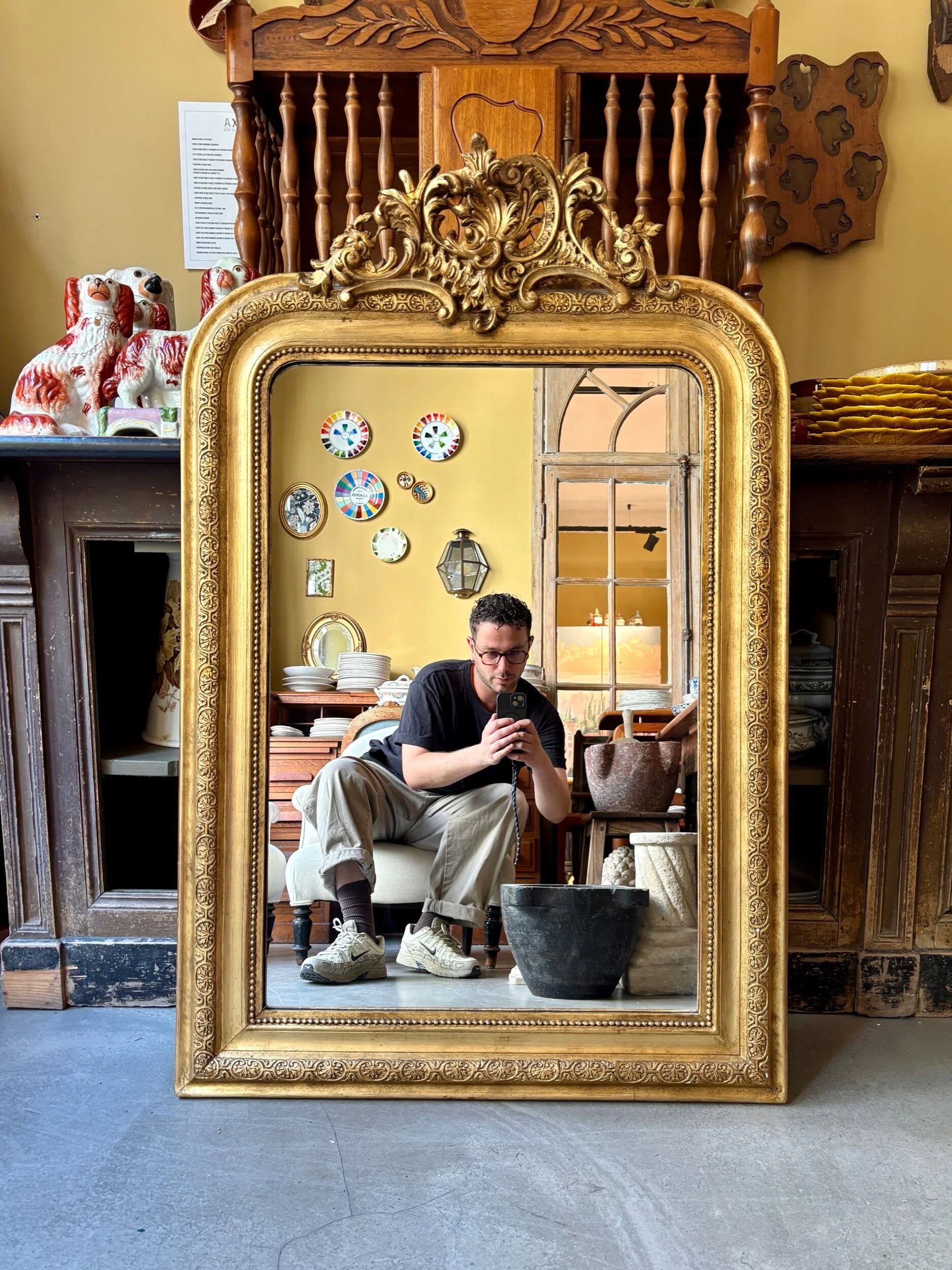 Gold sculpted and moulded stucco trumeau mirror 113 x 78 cm