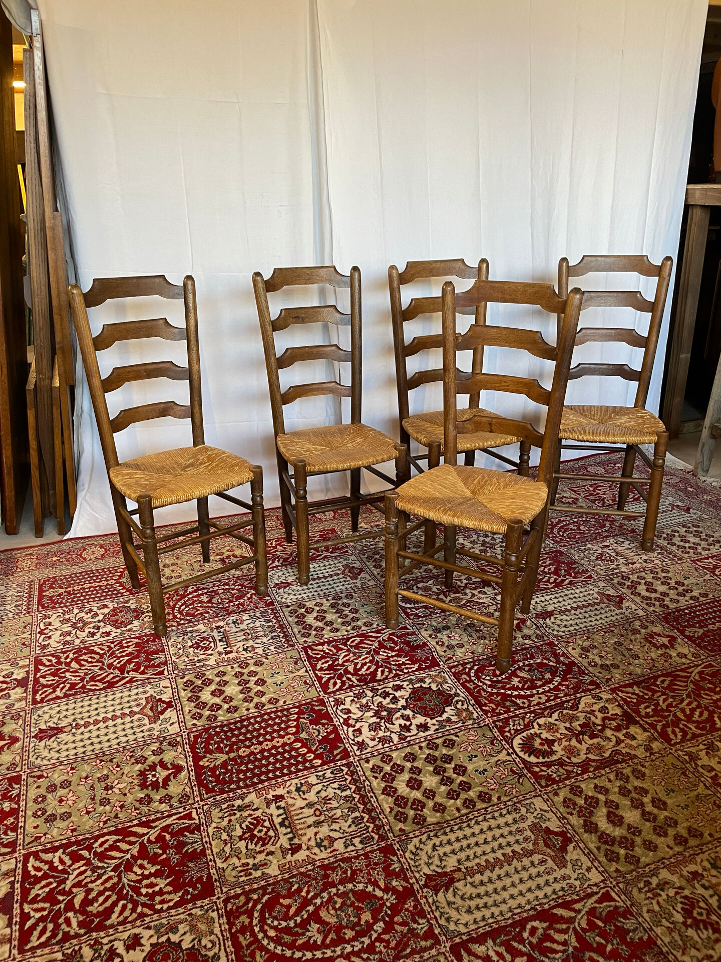 Set of 5 antique oak and straw chairs.