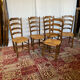 Set of 5 antique oak and straw chairs.