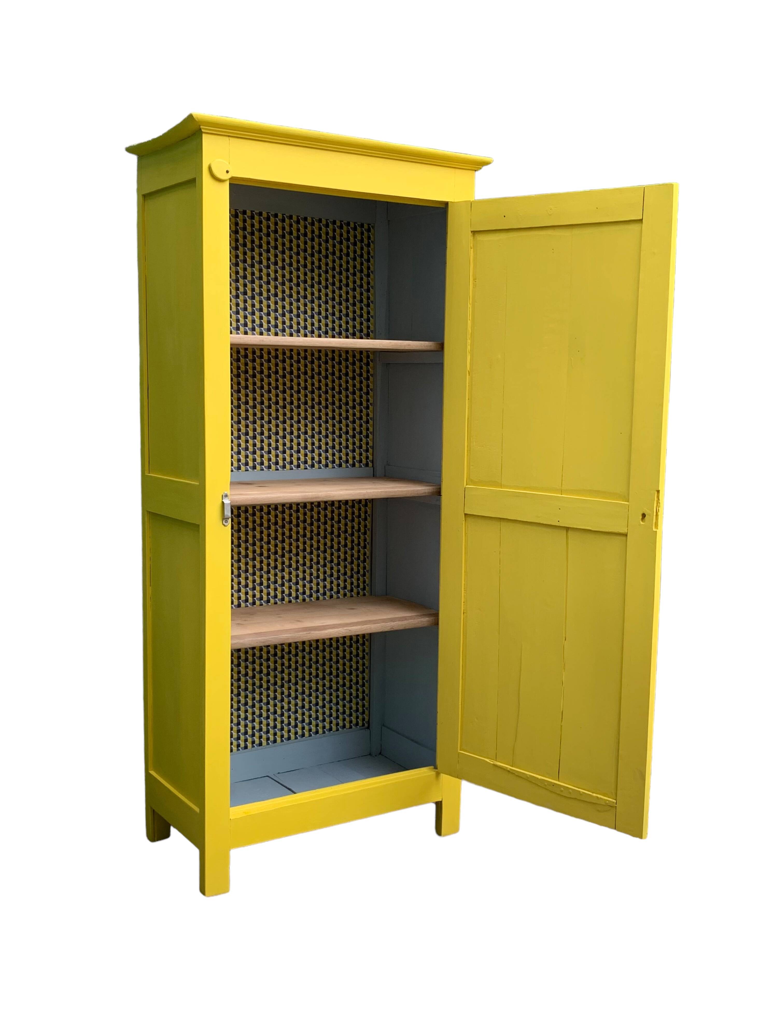 Antique powder yellow Parisian bonnetière wardrobe.