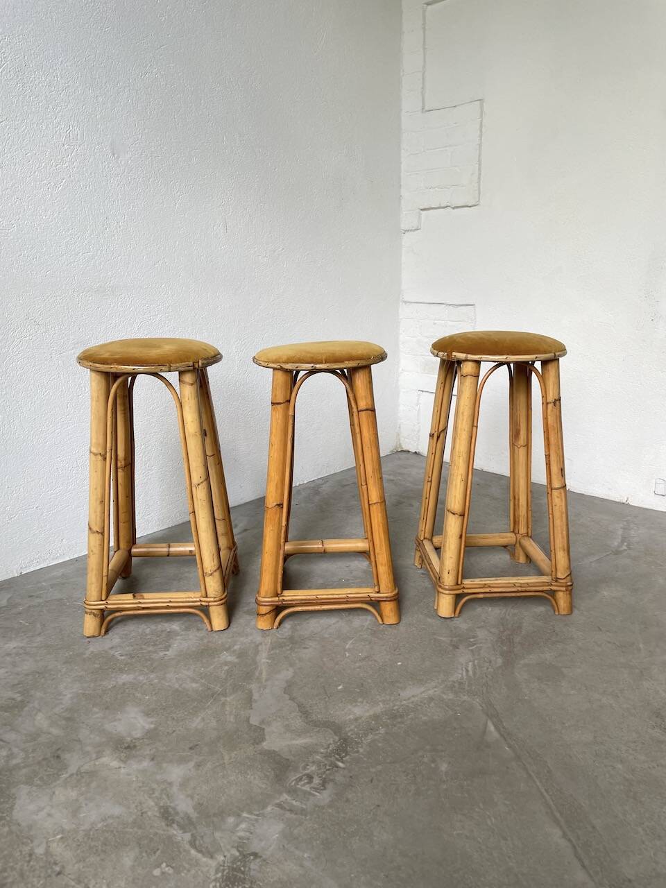 Set of three rattan high stools