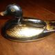 Black and gold wooden duck