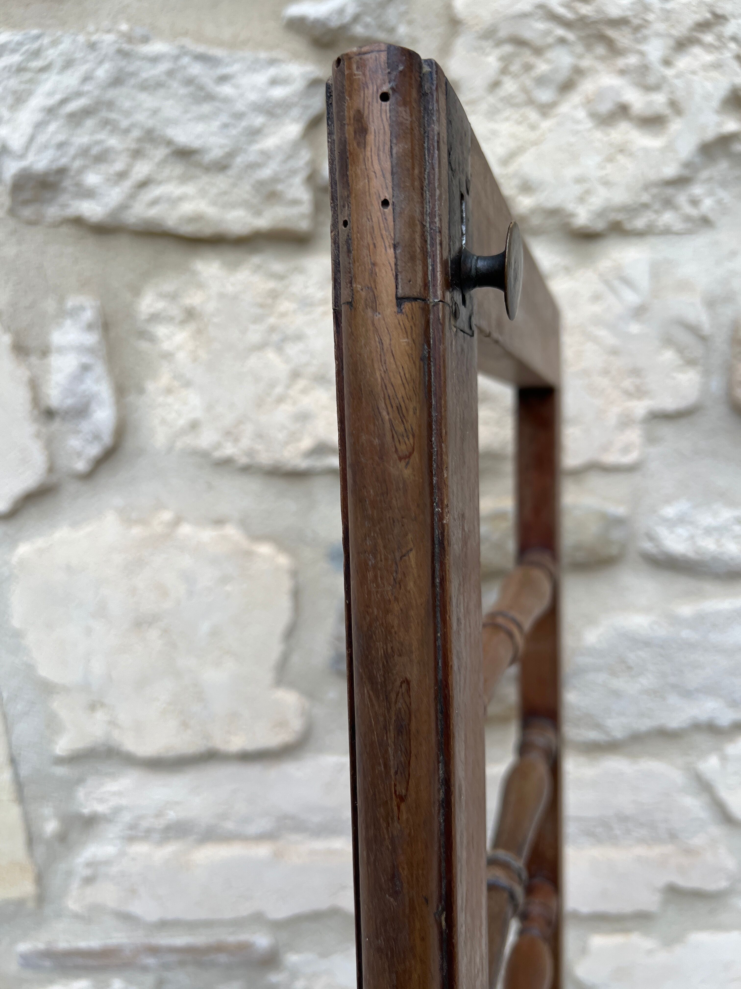 Old children's bed with retractable walnut bars