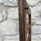 Old children's bed with retractable walnut bars