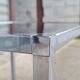 Pair of side tables in chrome metal and glass