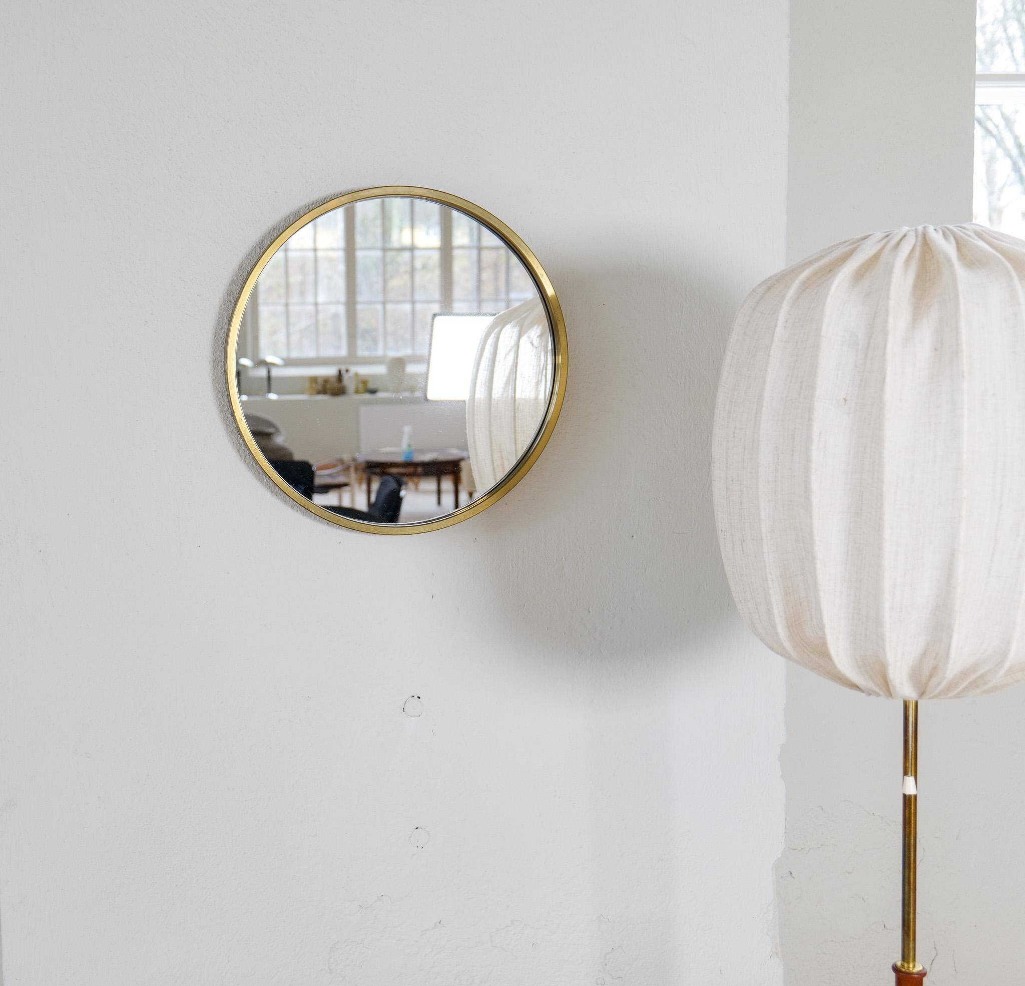 Round brass mirror from the mid-century by Glasmäster in Markaryd, Sweden, 1960s.