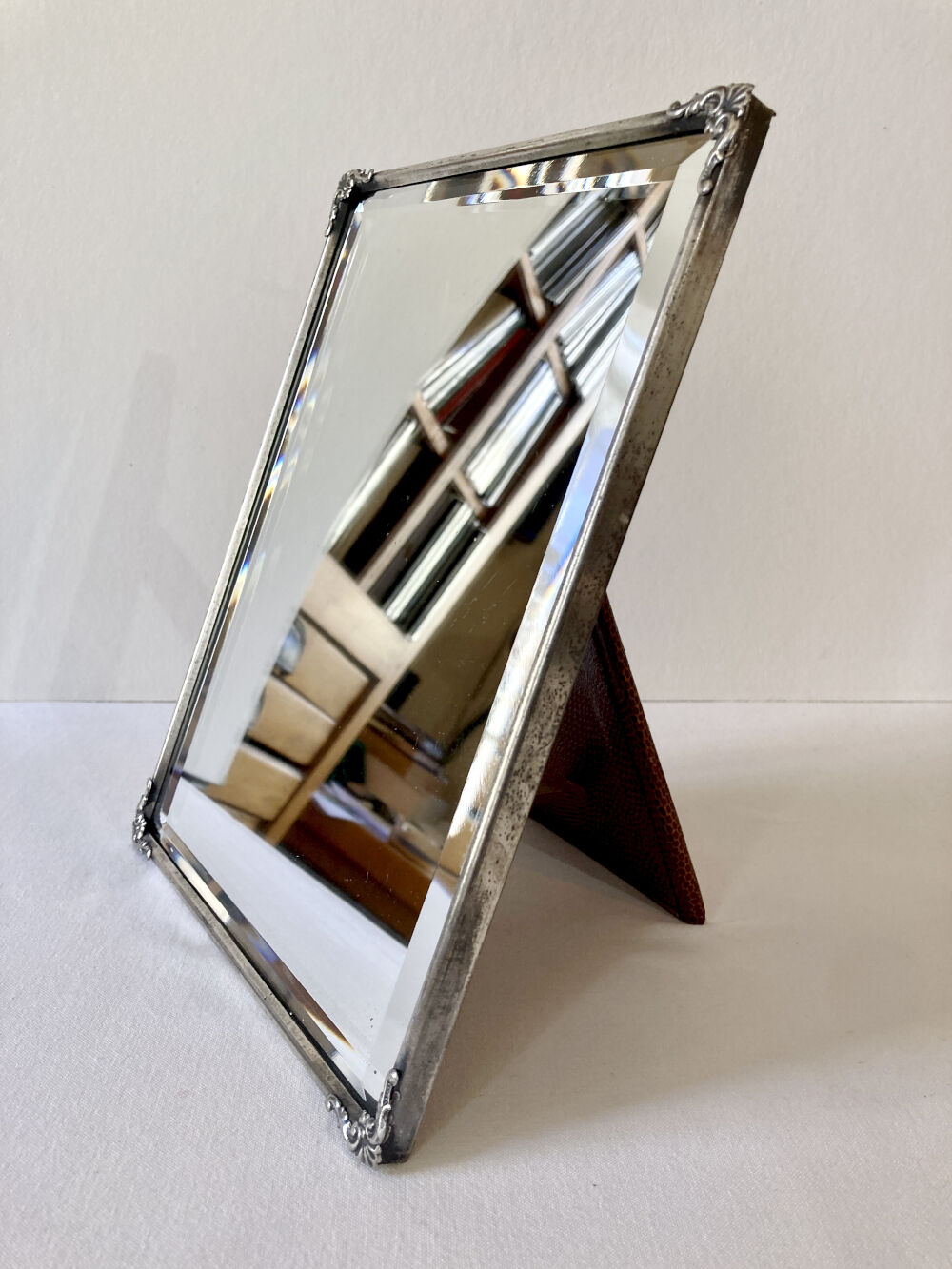 Antique framed mirror, bevelled glass and silver-plated metal frame, 1930-1940.