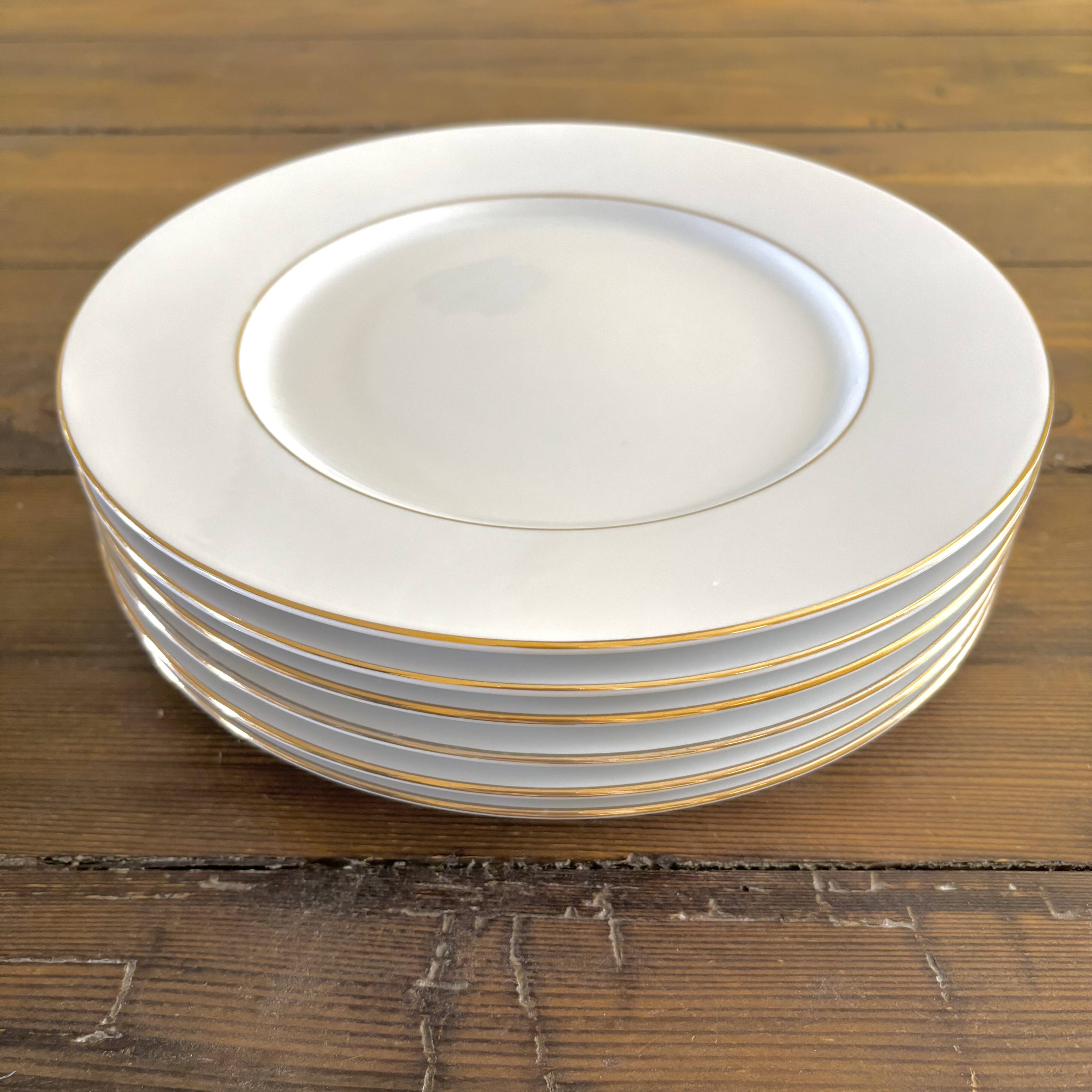 White and gold porcelain dinner plates