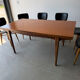 Rectangular extendable table in Scandinavian design made of solid teak.