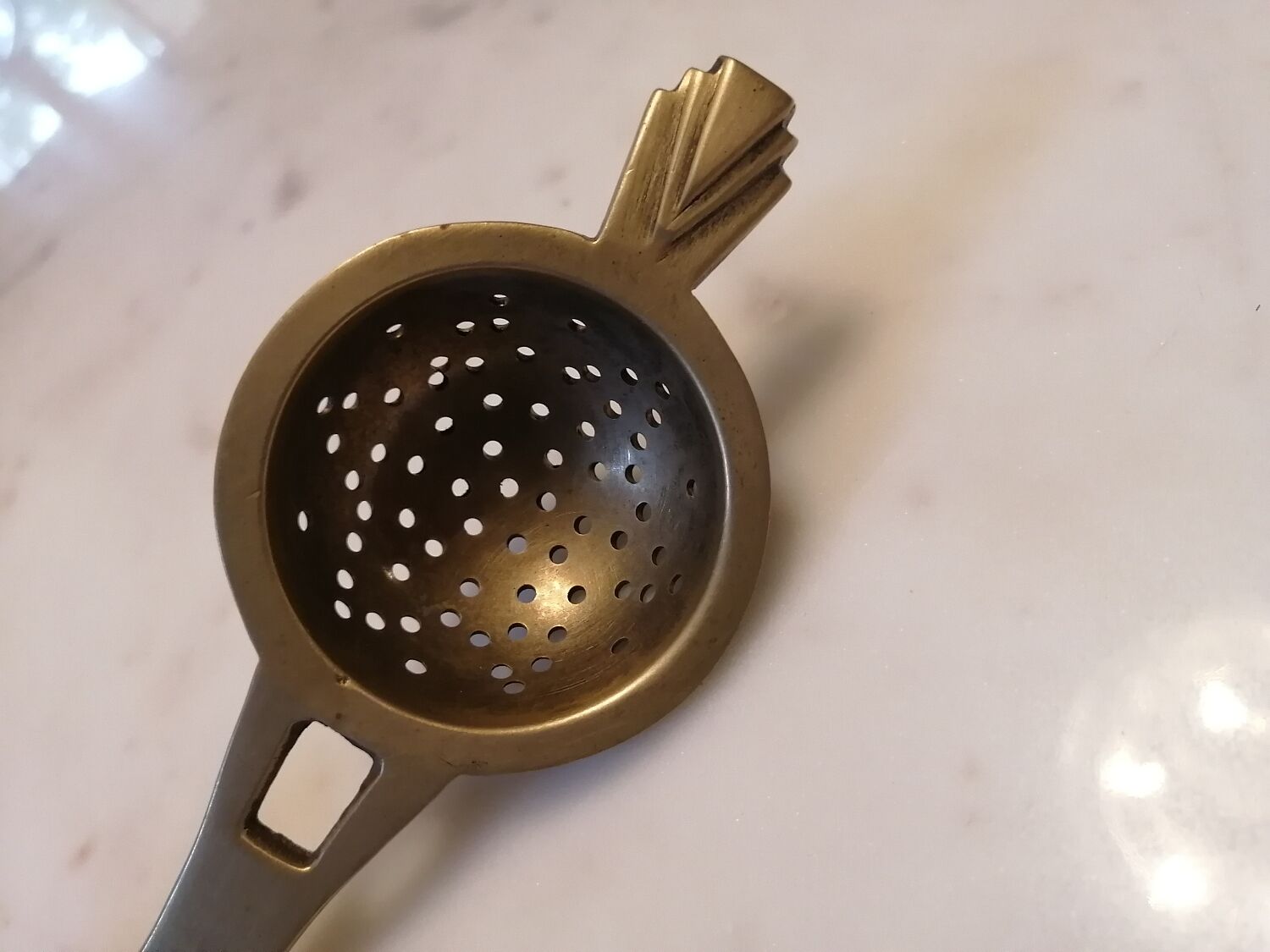 Art deco tea colander