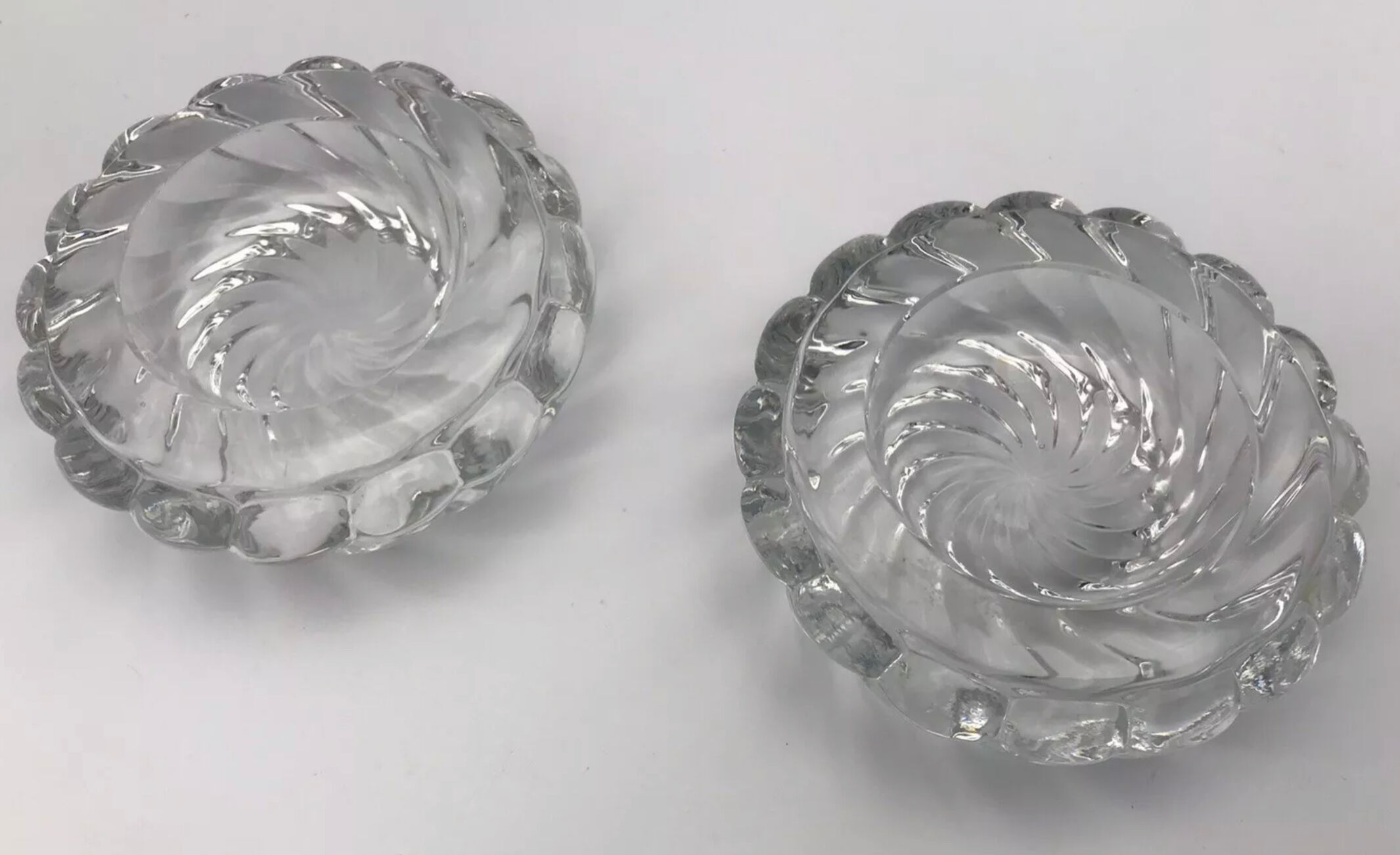 Pair of twisted round candlesticks in baccarat crystal stamped