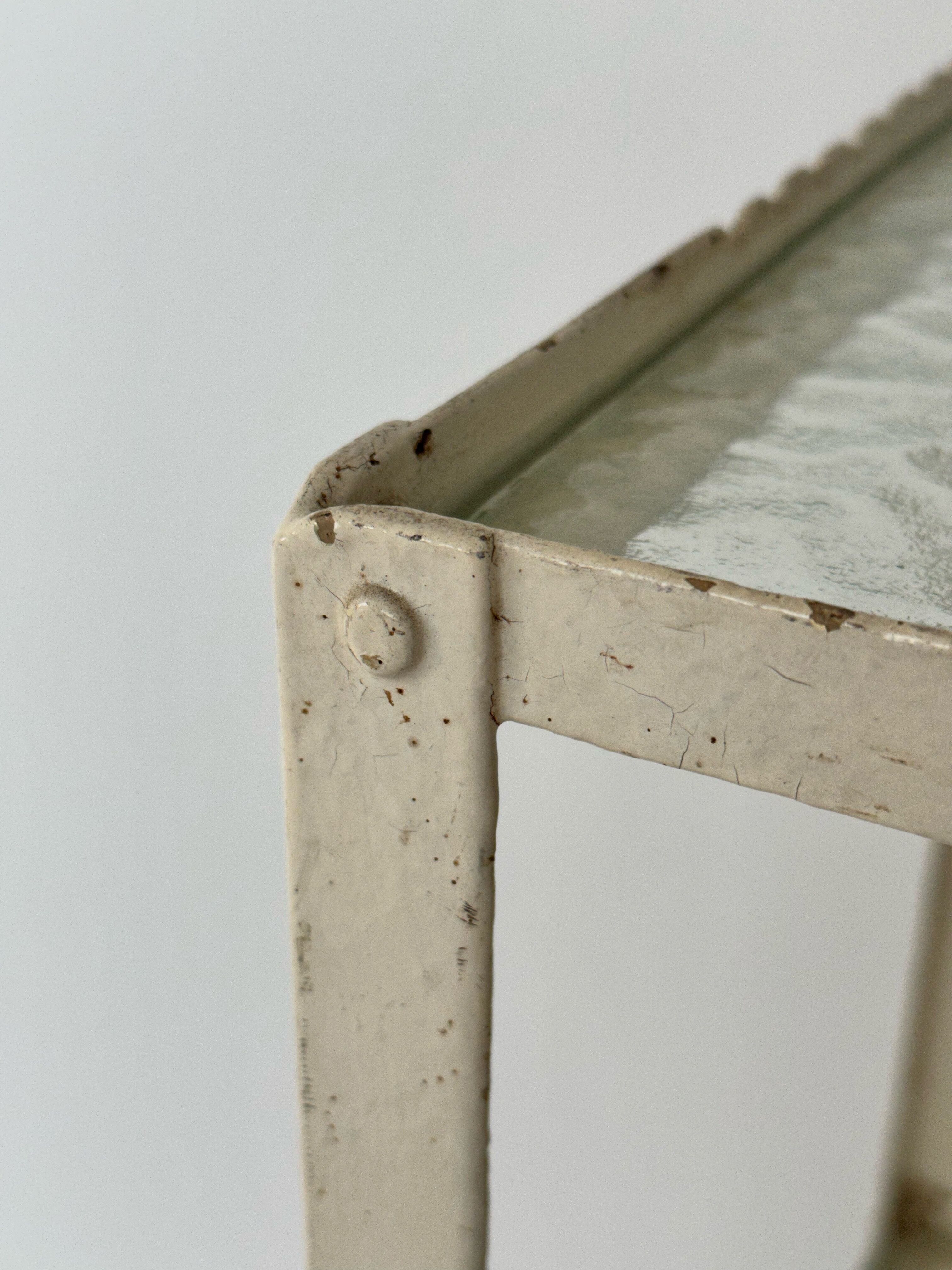 Industrial furniture serving or metal dentist's side table from the 1930s