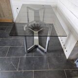 Chromed metal table with smoked glass top