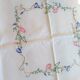Antique linen tablecloth embroidered with flowers