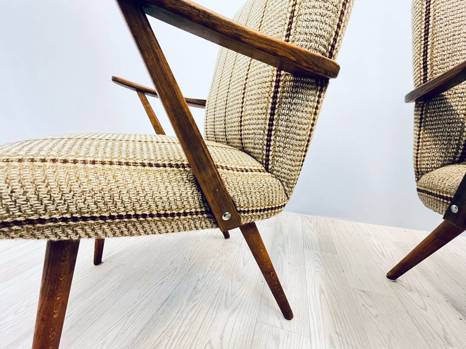 A pair vintage cocktail chairs with stripes and metal screws