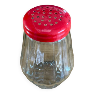 Glass shaker and red lid