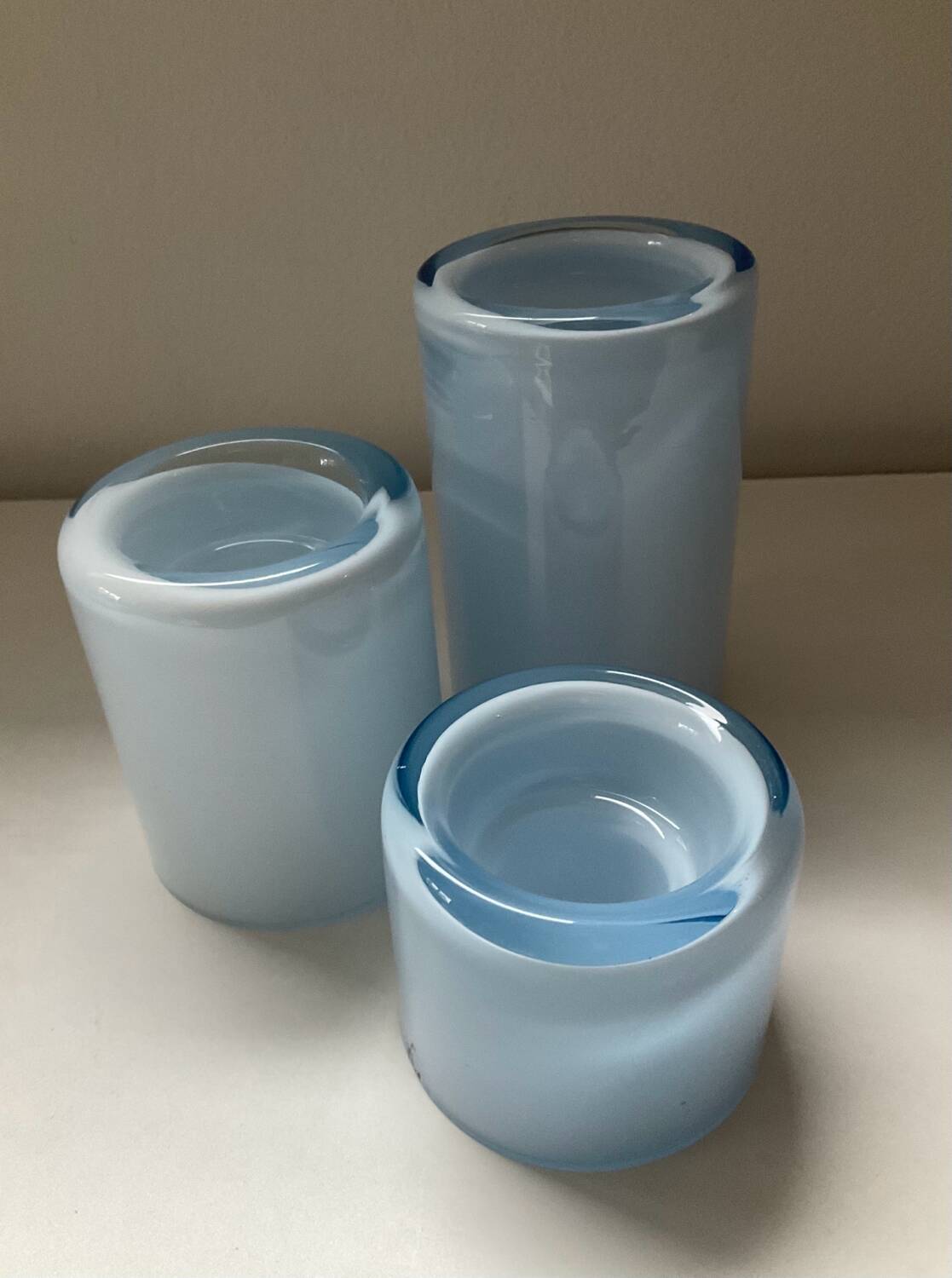 Trio of vintage candlesticks in double-layer glass paste