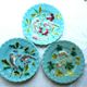 Blue barbotine plate of Sarreguemines: Birds pecking at yellow grapes