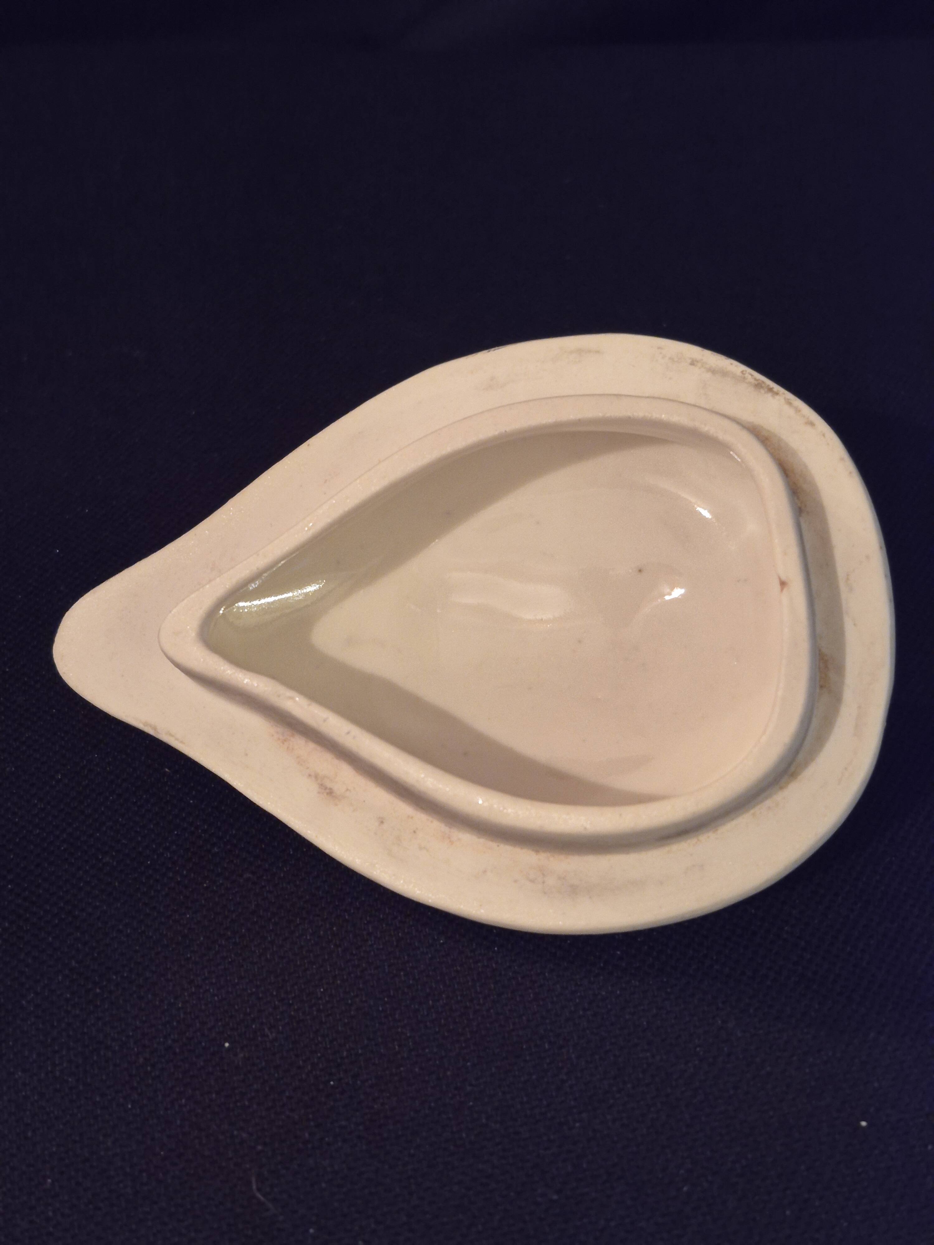 Vintage vase, geometric frieze and flowers with a black border.