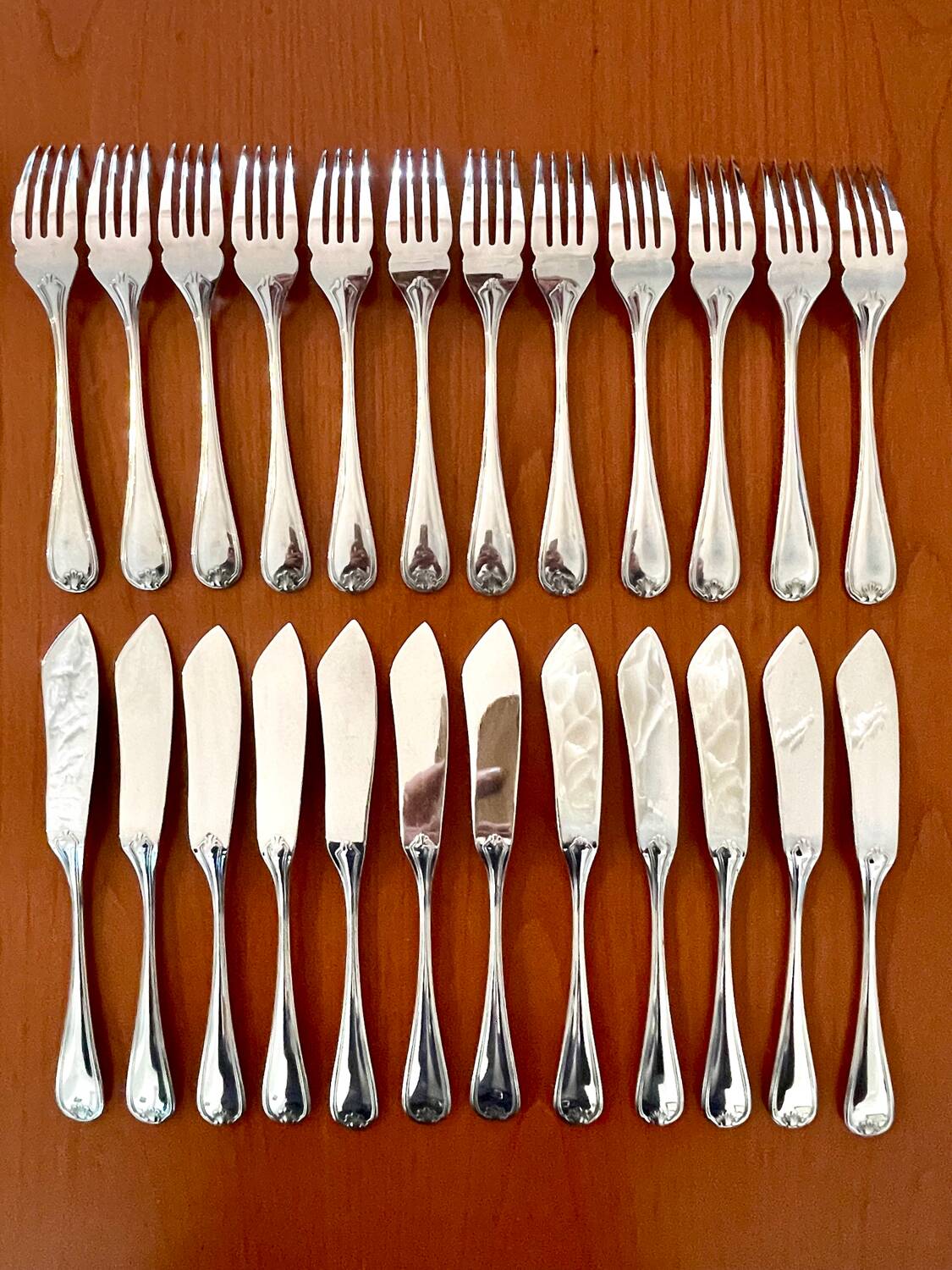 Christofle Marot Berain, 12 fish cutlery sets, shell decor