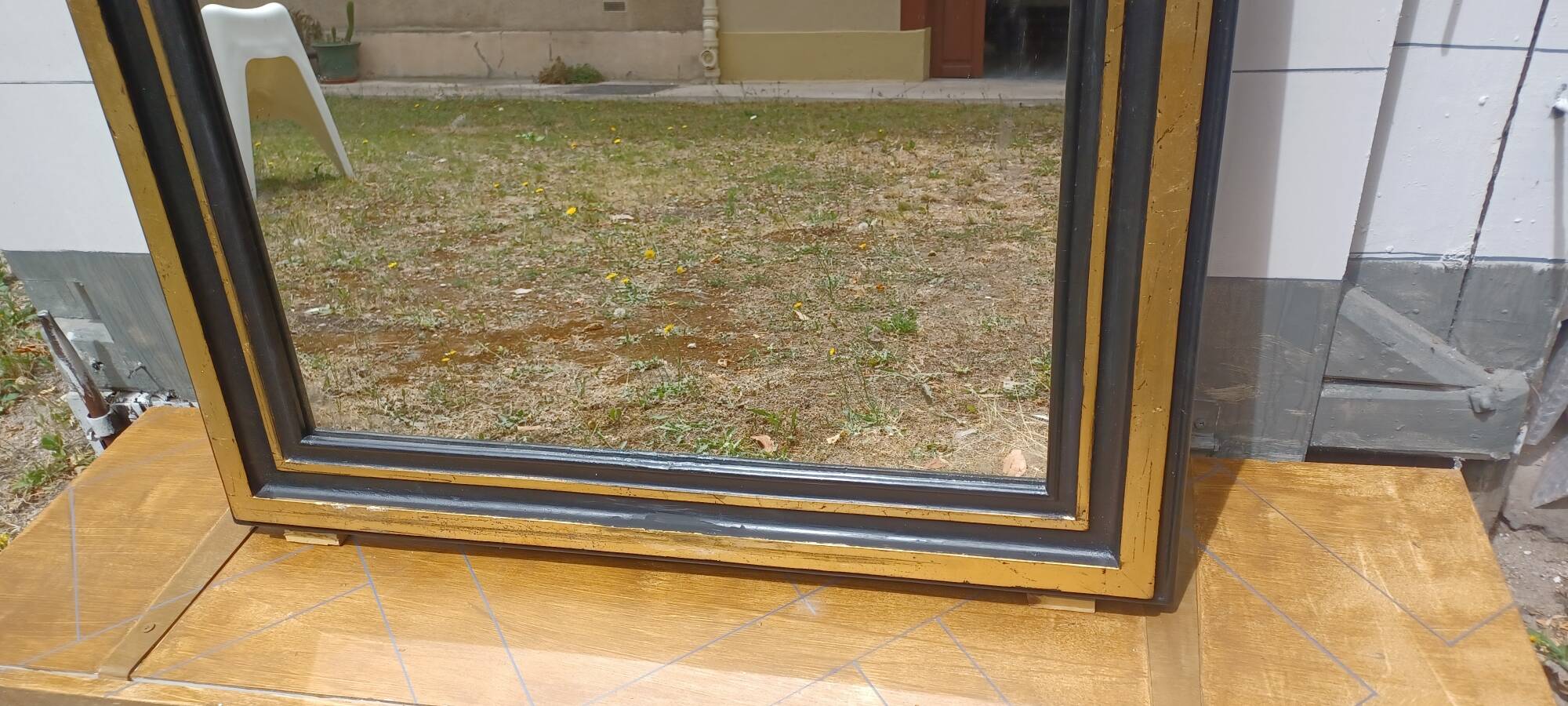 Vintage grand mirror in the 1970s style black and gold 109 x 79 cm