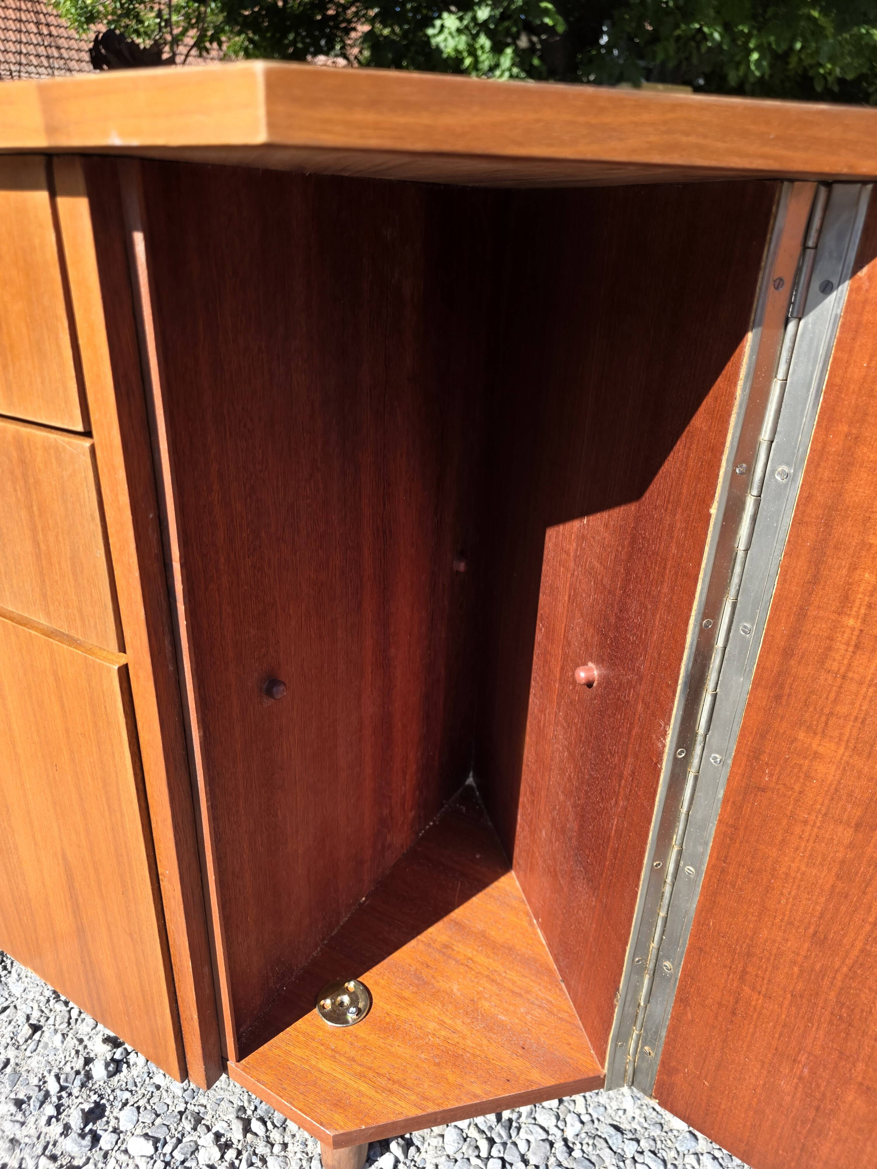 Scandinavian corner unit in teak from the 1960s.
