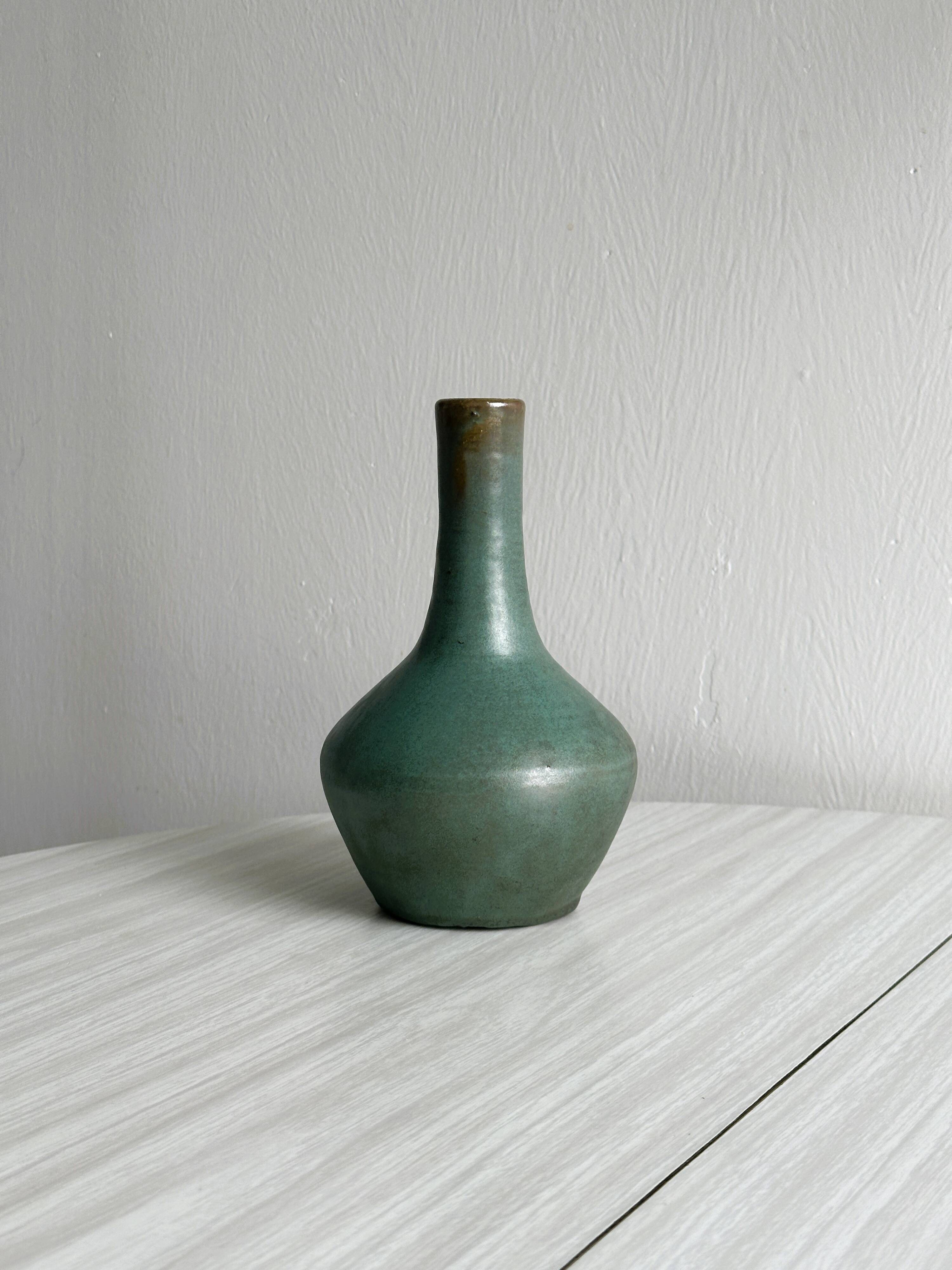 Green glazed ceramic vase