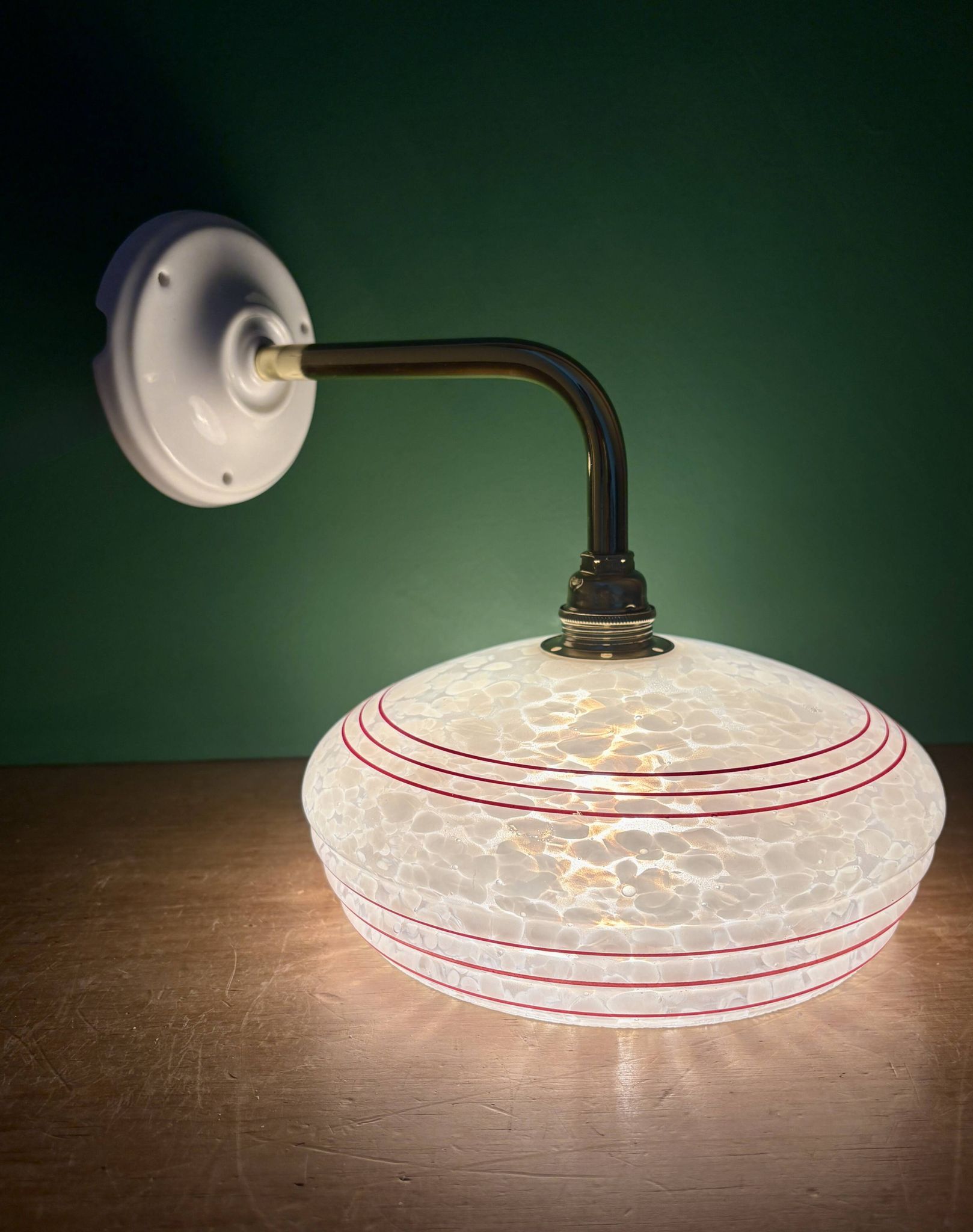 Vintage angled wall lamp with white clichy glass shade and red edging