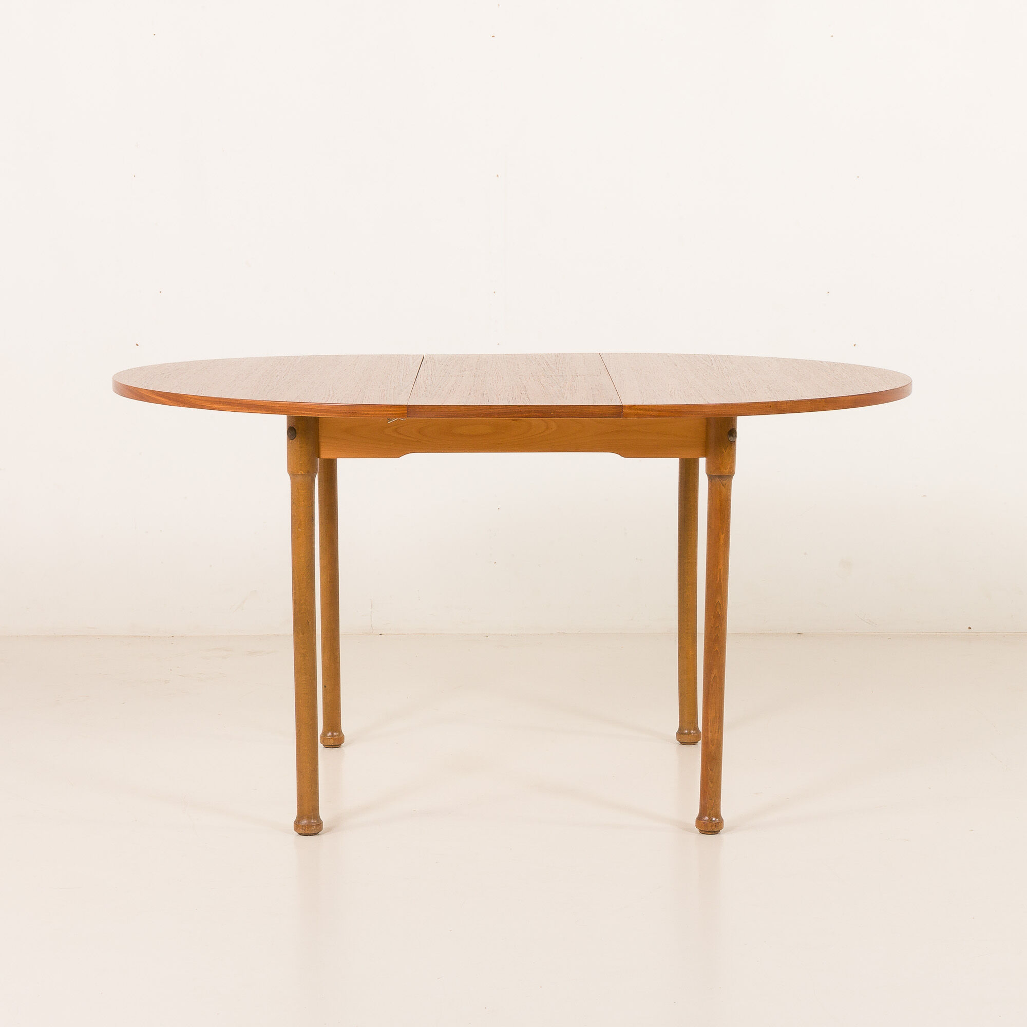 Teak round table with hidden extension, 1970s